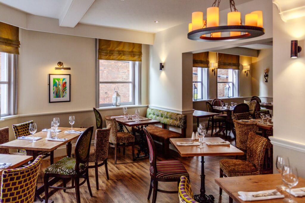 Dining tables laid with glassware and cutlery in Darwin's restaurant.